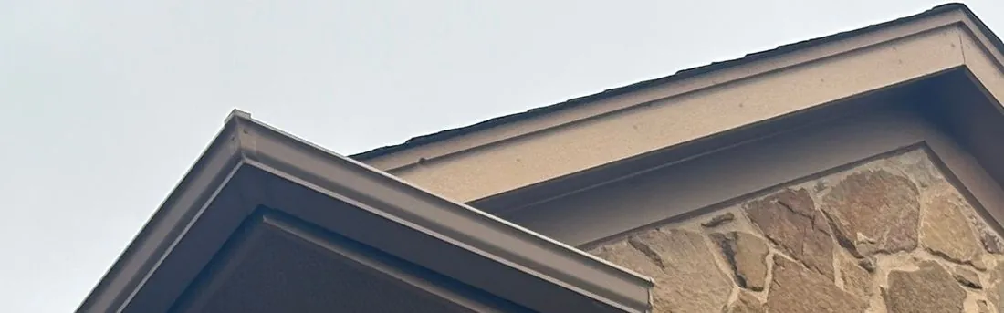 Drip edge metal profile along a roof edge, showing the outward kick that throws water clear of the fascia