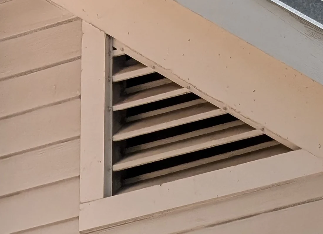 Louvered gable vent in the end wall of a Central Texas home