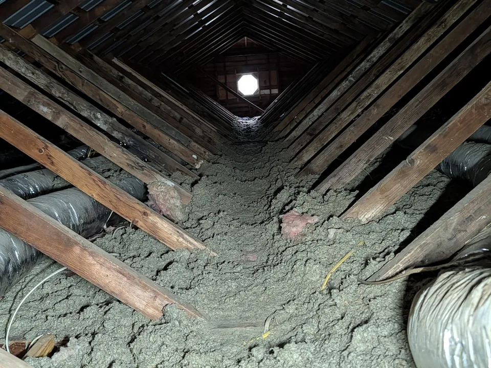 Attic view down the ridge toward an octagon gable vent