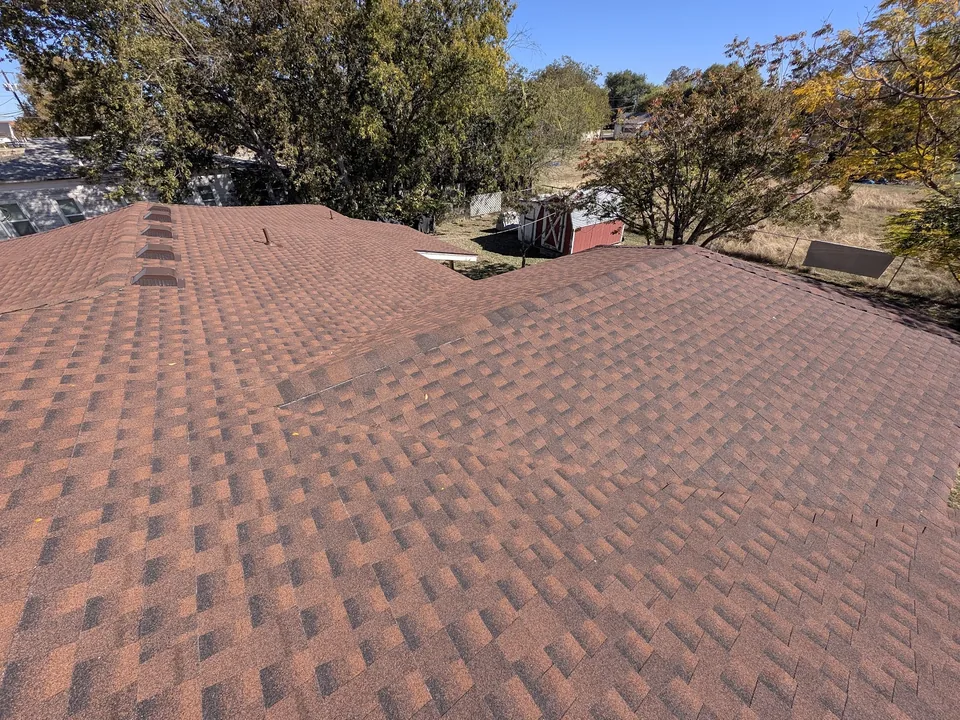 Red blend shingles with box vents along the ridge