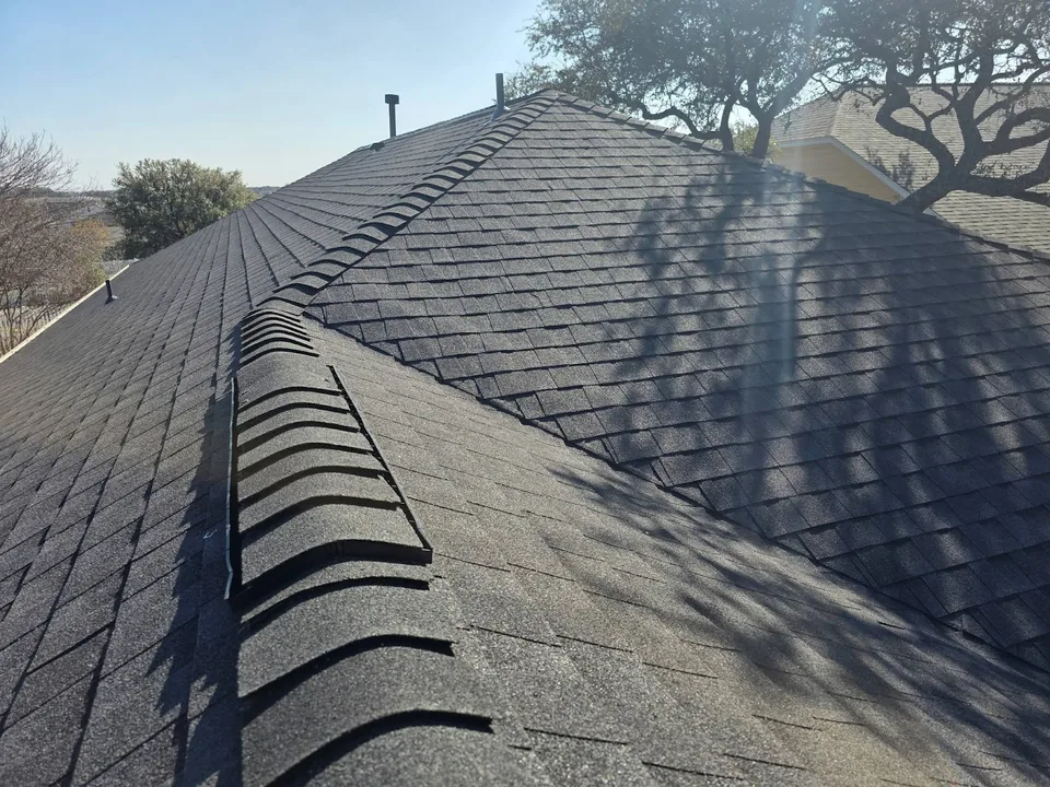 Ridge cap shingles over a ridge vent, close up
