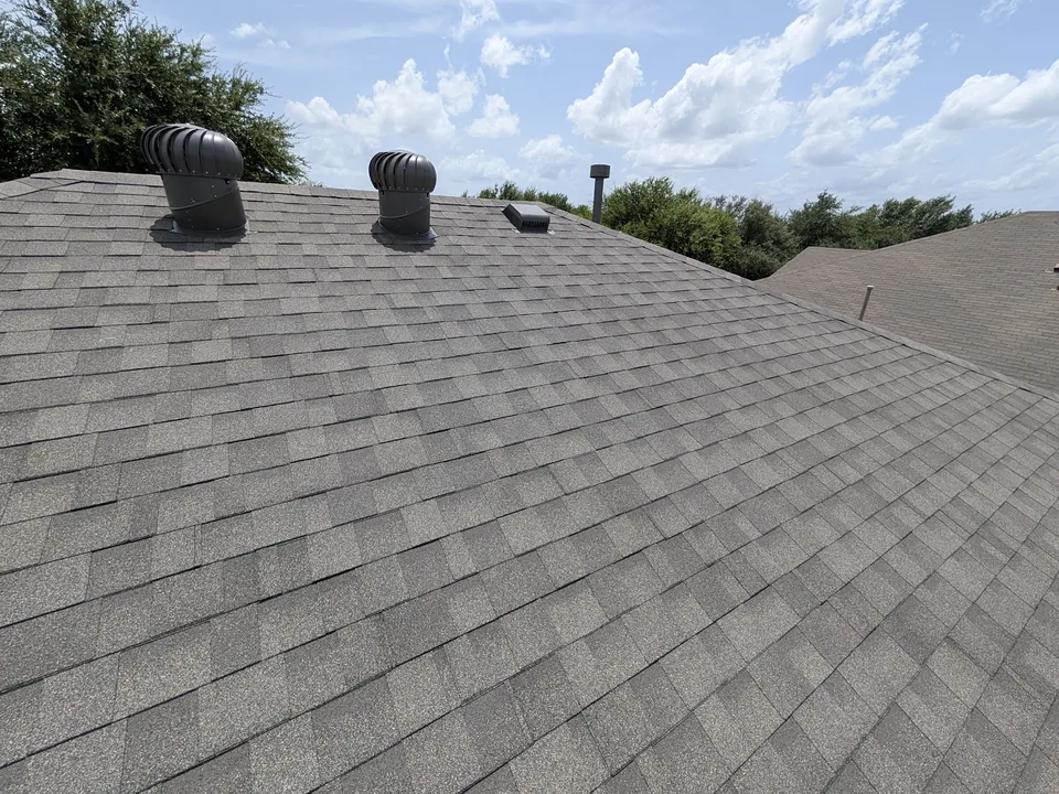 Turbine vents and a box vent on a shingle slope