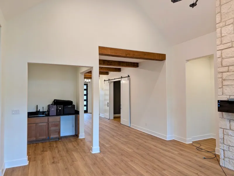 Finished open living area with satin white walls after interior painting in Georgetown, Texas.