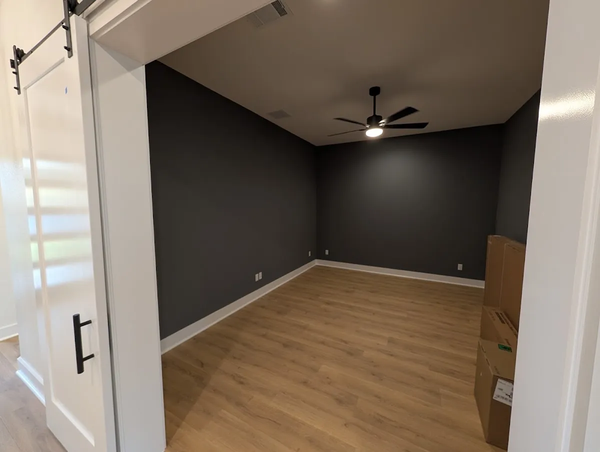 Finished darker gray media room after custom interior painting in Georgetown, Texas.