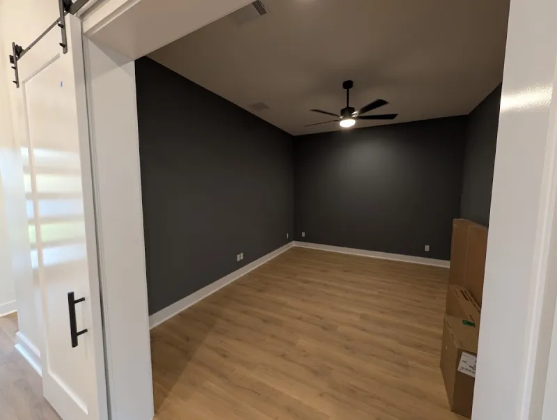 Finished darker gray media room after custom interior painting in Georgetown, Texas.